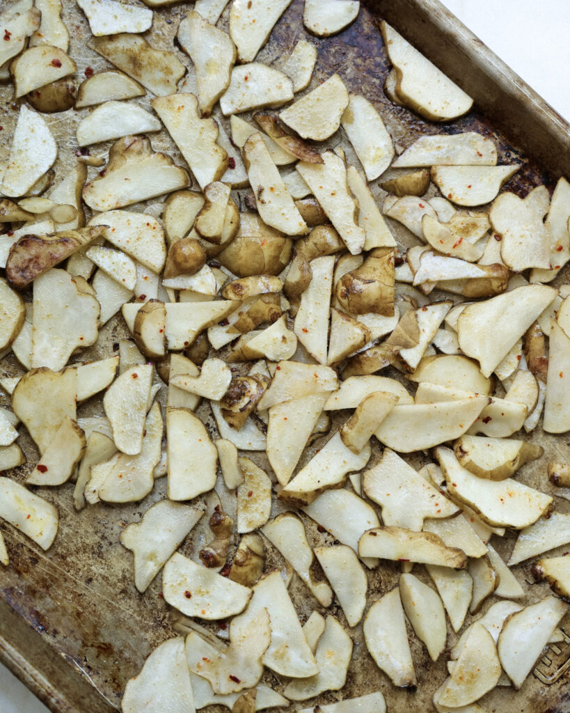 Sunchokes on a baking sheet.