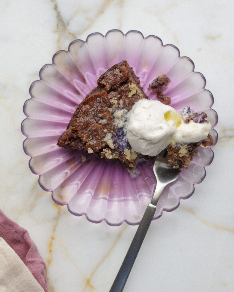 Blueberry brownie topped with vanilla gelato.