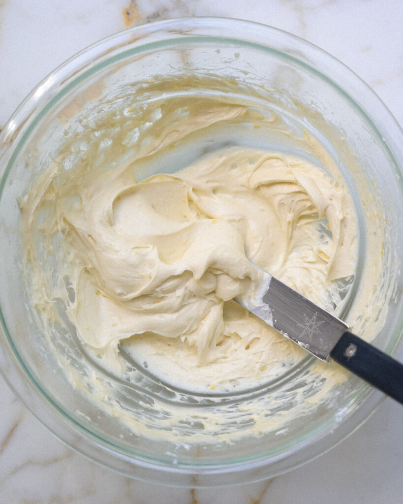 Lemon cream cheese frosting in a bowl.