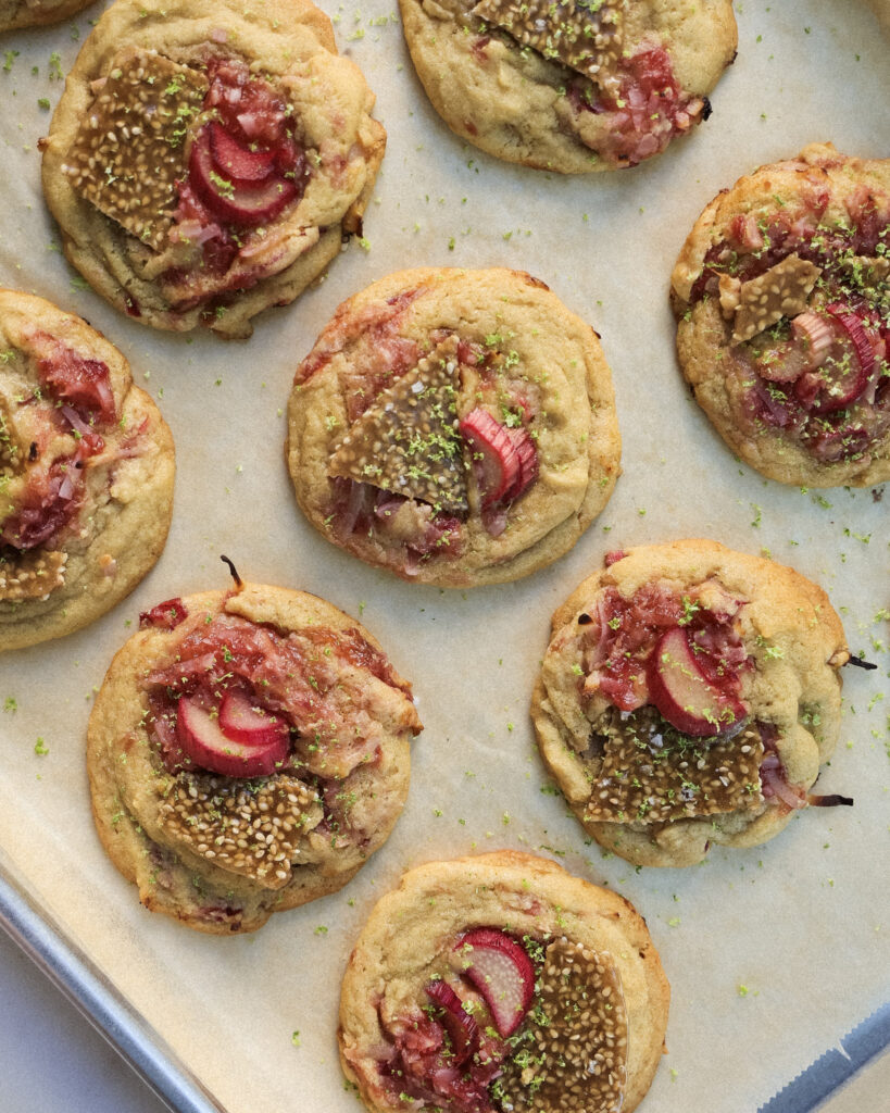 Rhubarb cookies with lime zest, macerated rhubarb and sesame bark on top.