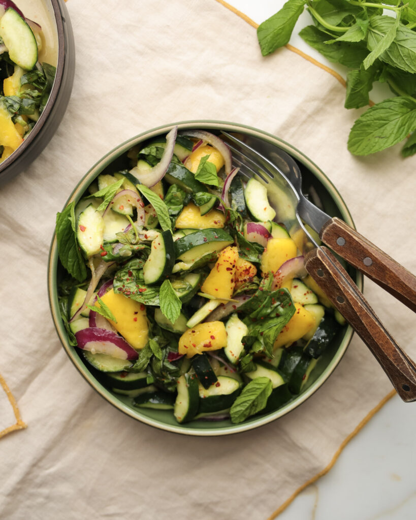 Cucumber and mango salad in a bowl.