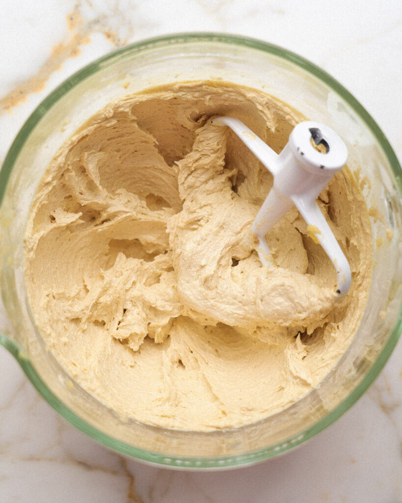 rhubarb cookie dough in the bowl of a stand mixer.
