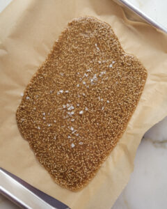 Sesame bark on a baking sheet.