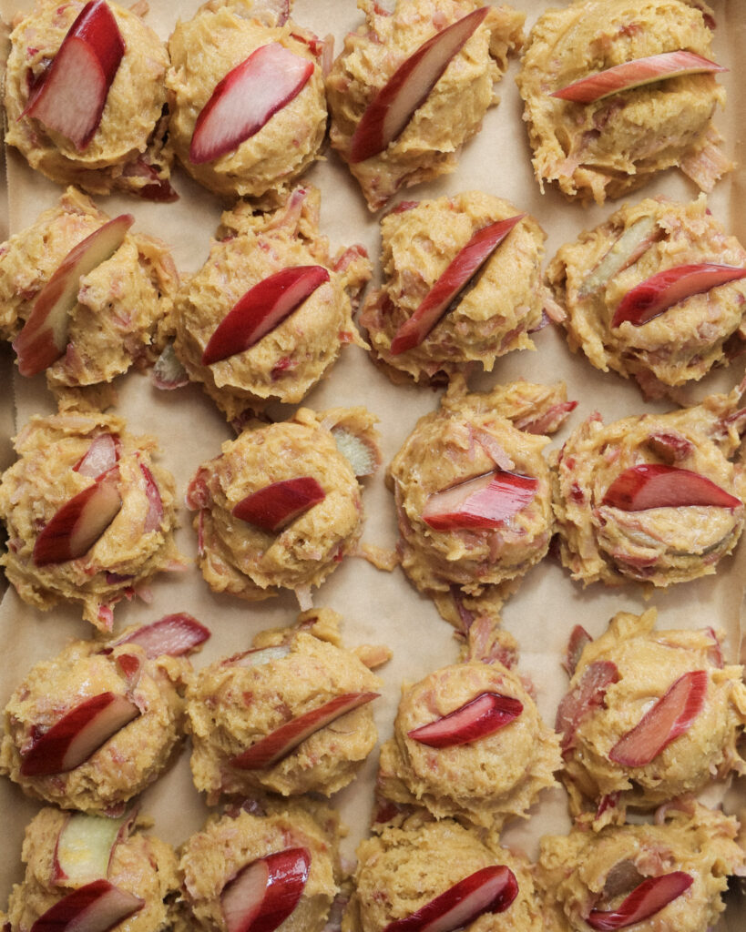 Rhubarb cookie dough balls with slices of rhubarb on top.